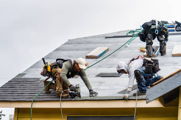 Professional Roofing technician working in Brookston, IN